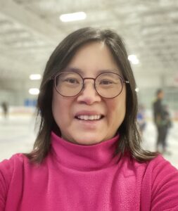 Head shot of Susan Sim at a hockey rink